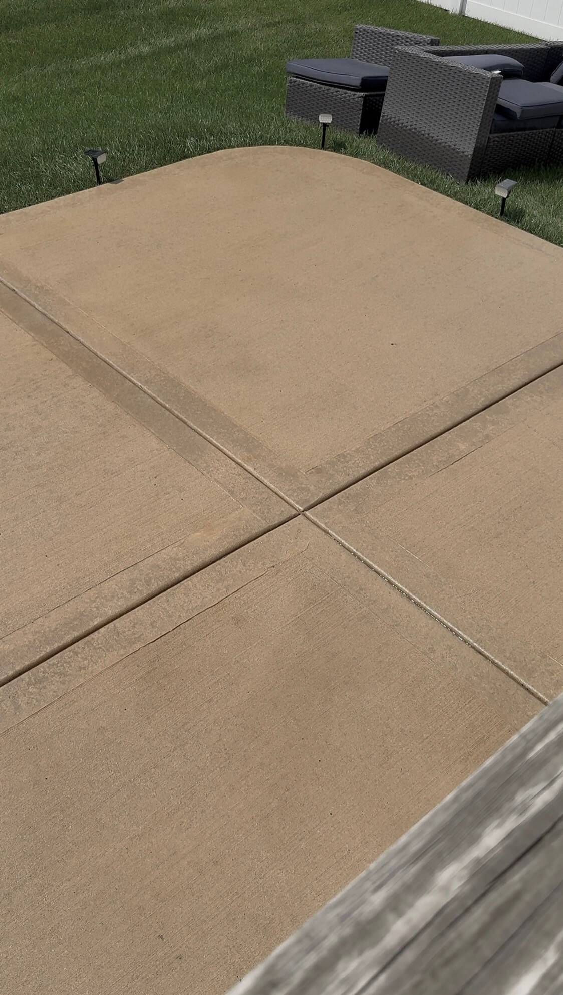 Clean restored concrete patio after Bin Bros concrete cleaning and pressure washing in Elmhurst, IL