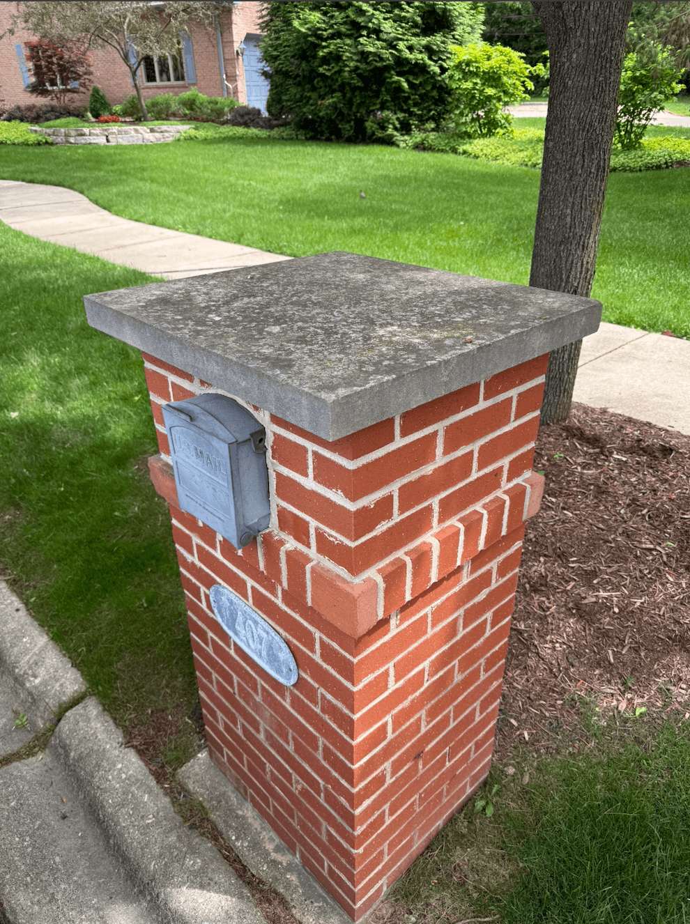 Dirty brick mailbox post with mildew on the cap before cleaning in Elmhurst, IL