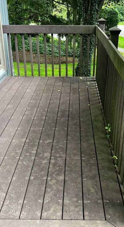 Dirty composite deck with dirt and debris before cleaning in Elmhurst, IL